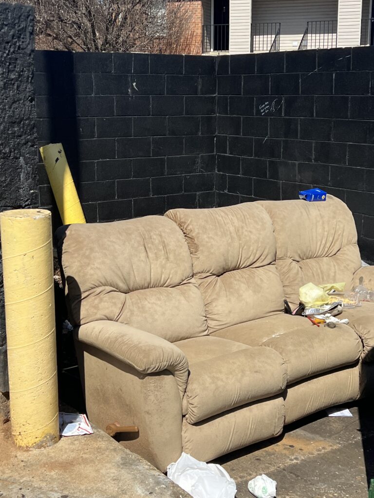 Couch with trash