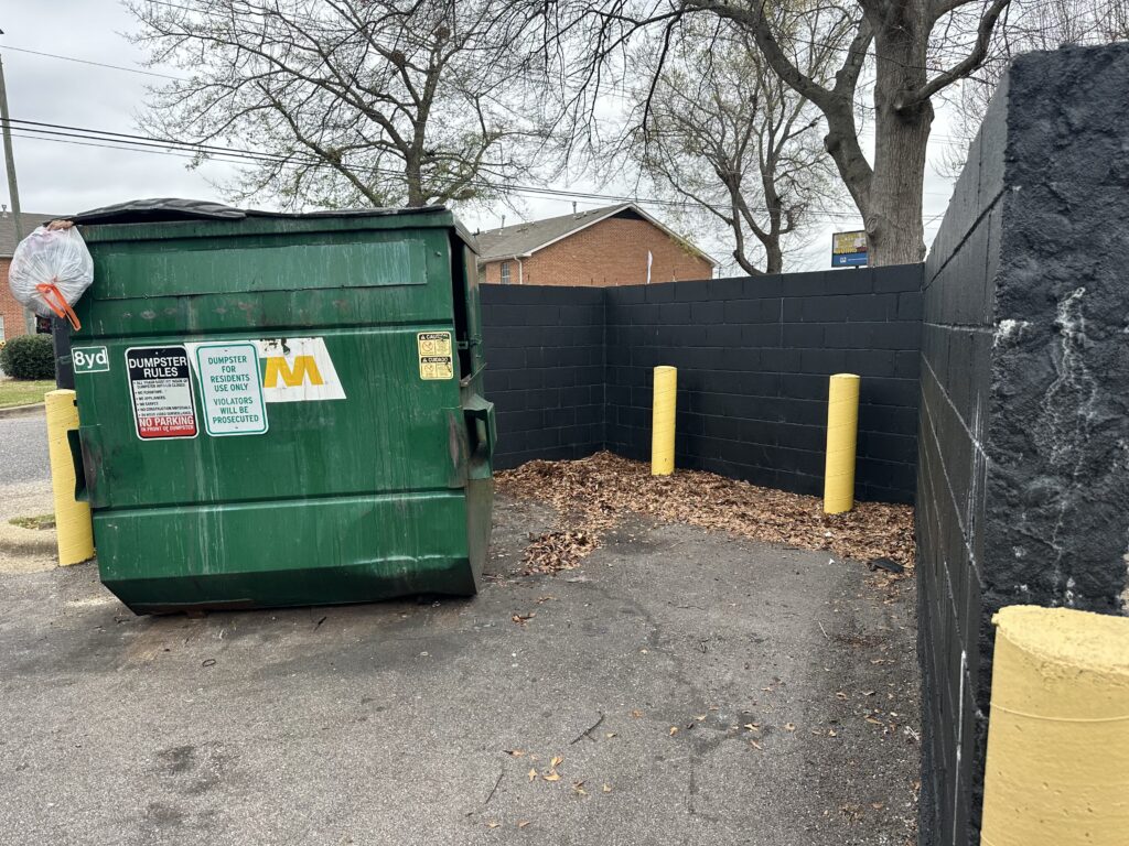 Dumpster with leaves